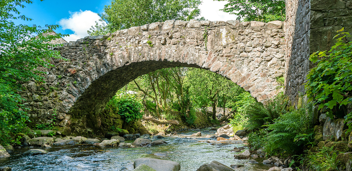 The bridge over Whillan Beck, with our namesake cottage in the background